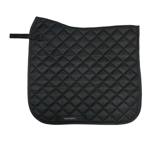 A black quilted saddle pad with a diamond pattern and a small black brand label at the bottom edge, shown on a plain white background.