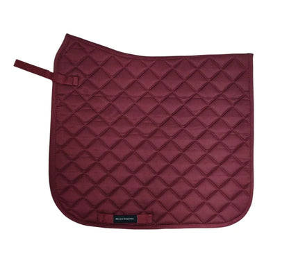 A quilted horse saddle pad in burgundy, featuring a diamond-quilted pattern and a small black brand label near the bottom edge, set against a plain white background.